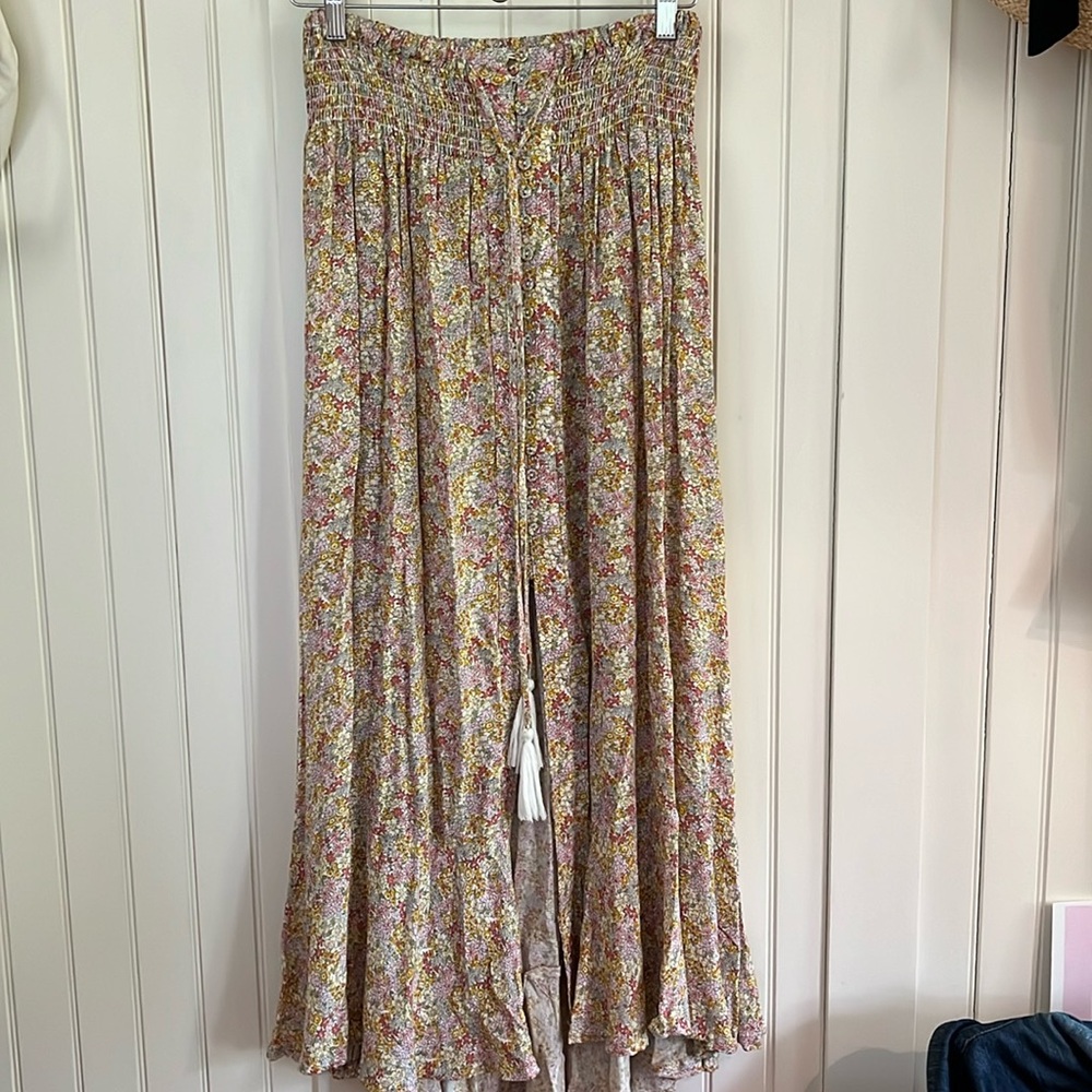 Scrunchy long skirt with elastic smocked waist and button front.